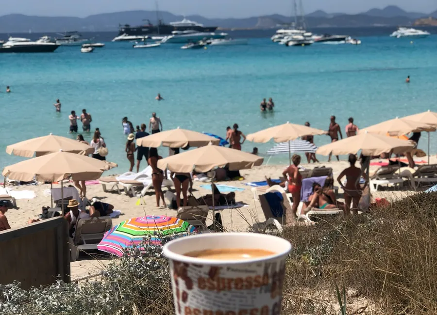 Beach bar view of yachts and boats off Formentera
