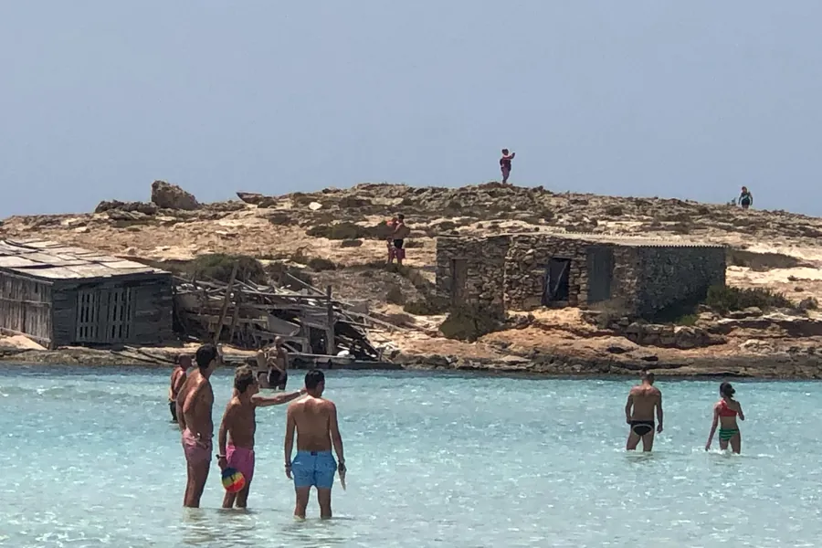 Old fishermen’s huts on the rocky headland of Ses Illetes