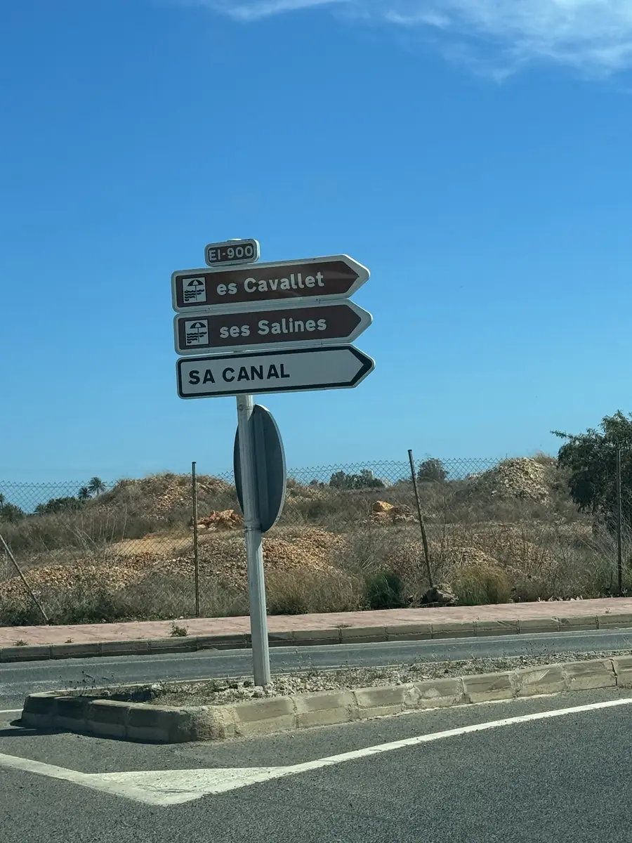 Brown signpost on the EI-900 road toward Ses Salines and Es Cavallet in the salt flats nature reserve